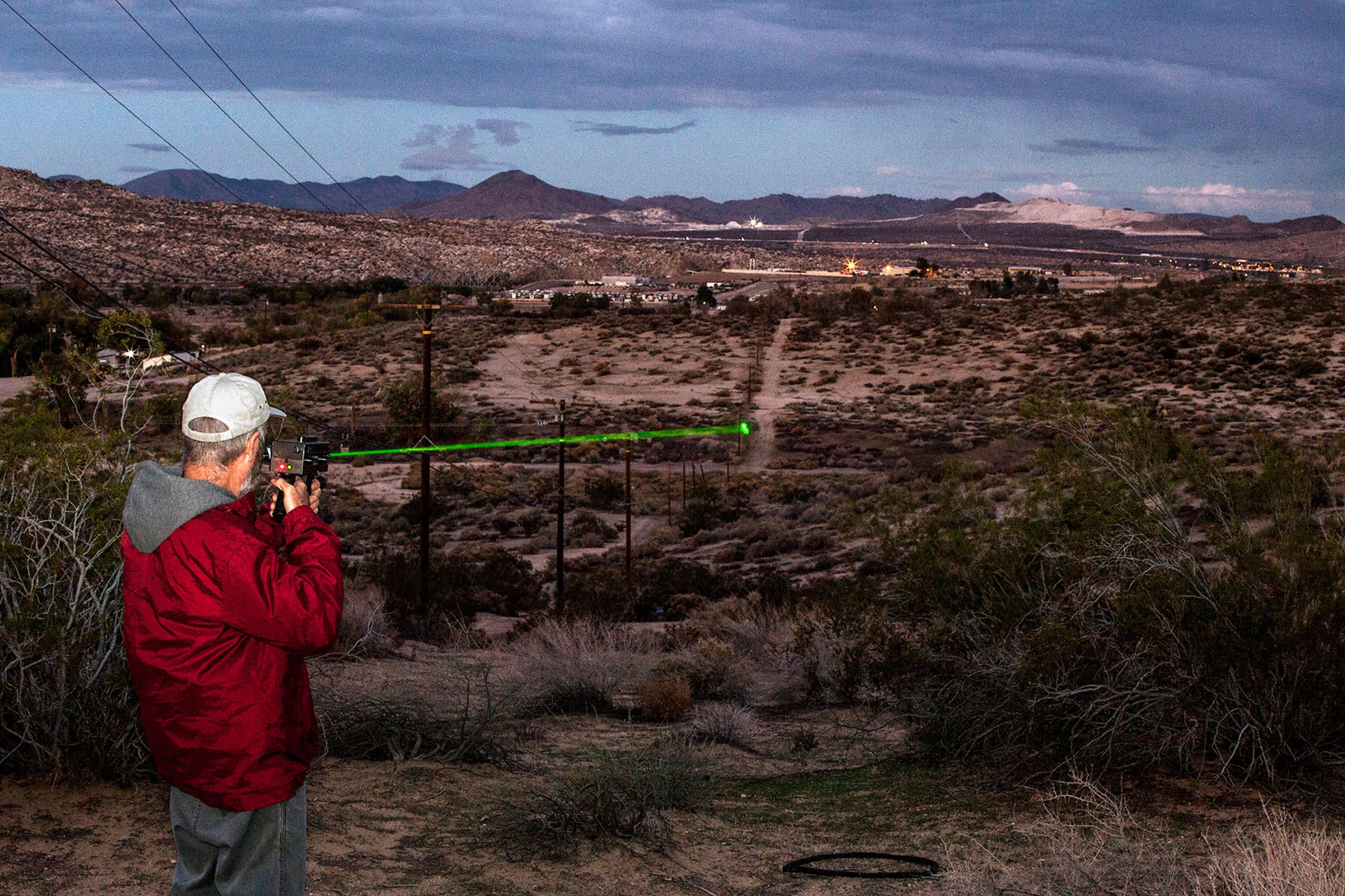 Testing a raven-repelling laser in the Mojave Desert. The beam, which doesn't harm its targets, has a range of roughly a mile. Tom Fowlks