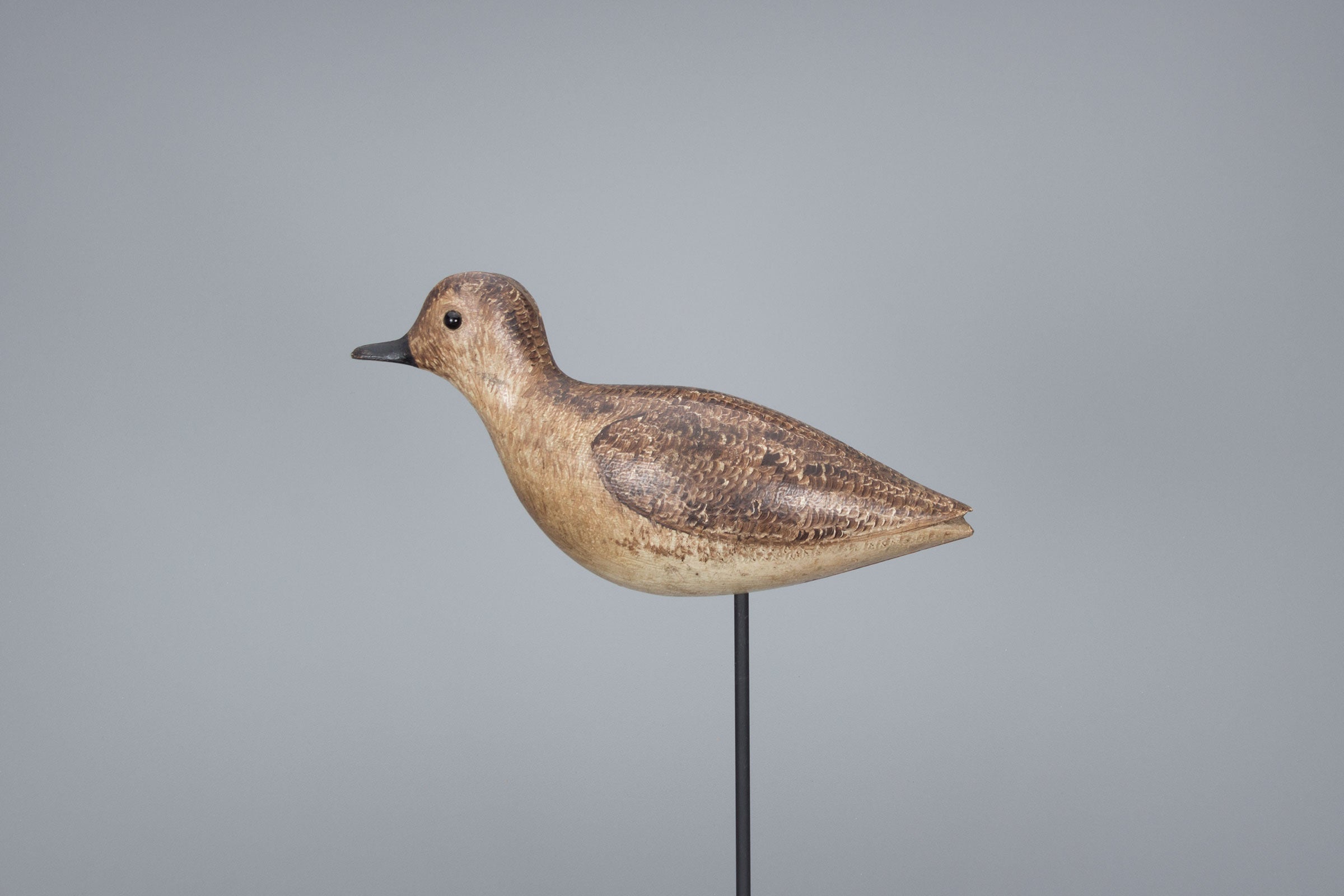 Small shorebirds such as this plover are often represented by generic decoys: The birds themselves aren’t very picky about what they come to investigate. Hunters would also play snipe whistles to help attract the birds. Copley Fine Art Auctions, LLC