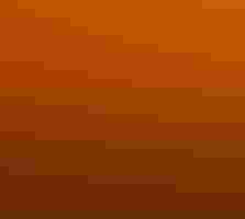 Flock of birds flying high above a long row of wind turbines against an orange sunset