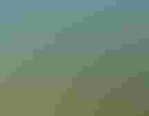 An aerial landscape dotted with small bodies of water.