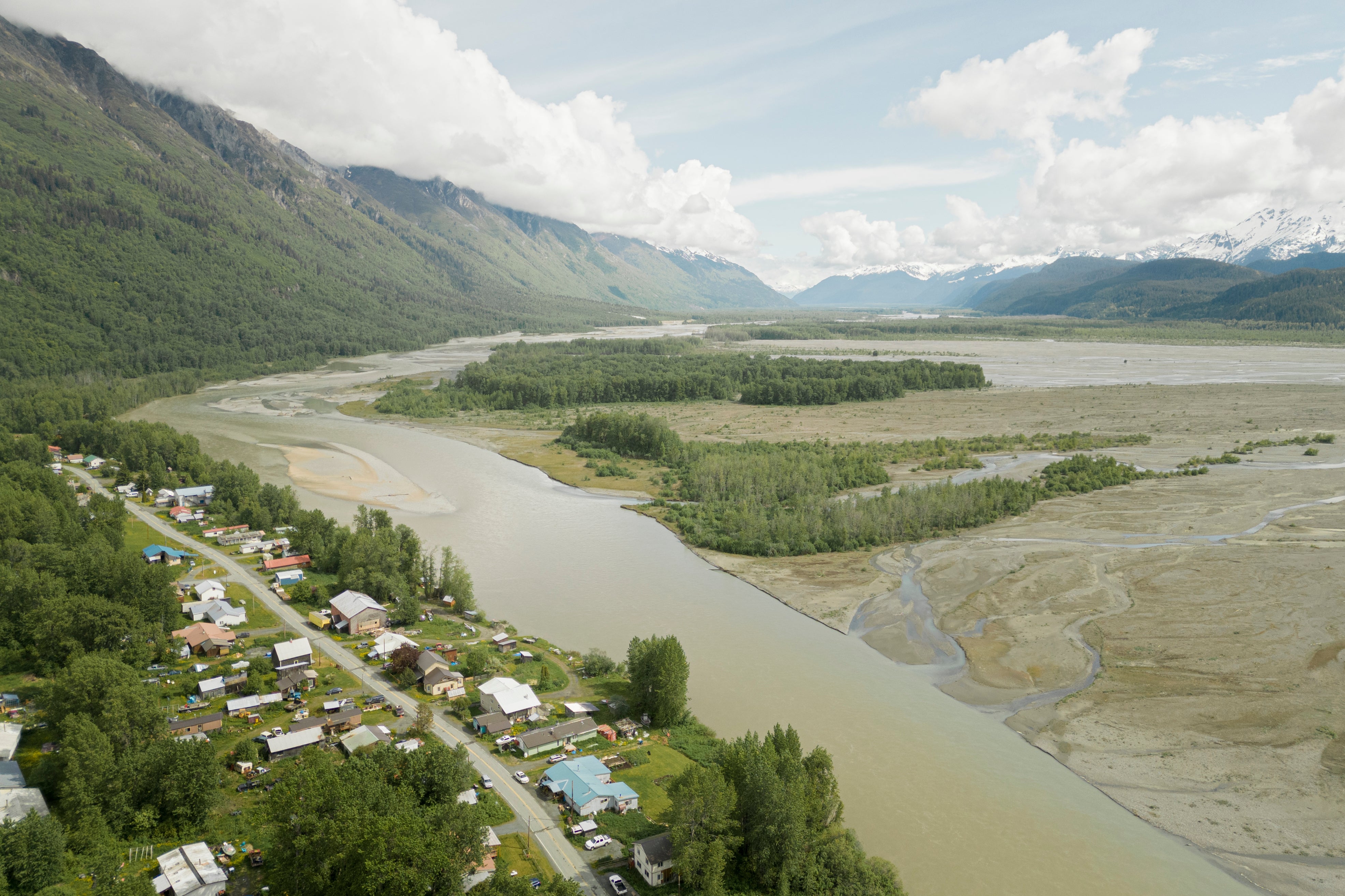 Overview photo of a river with a town next to it.