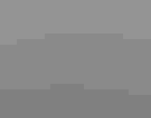 A hallway with imagery on the walls and tabletop displays