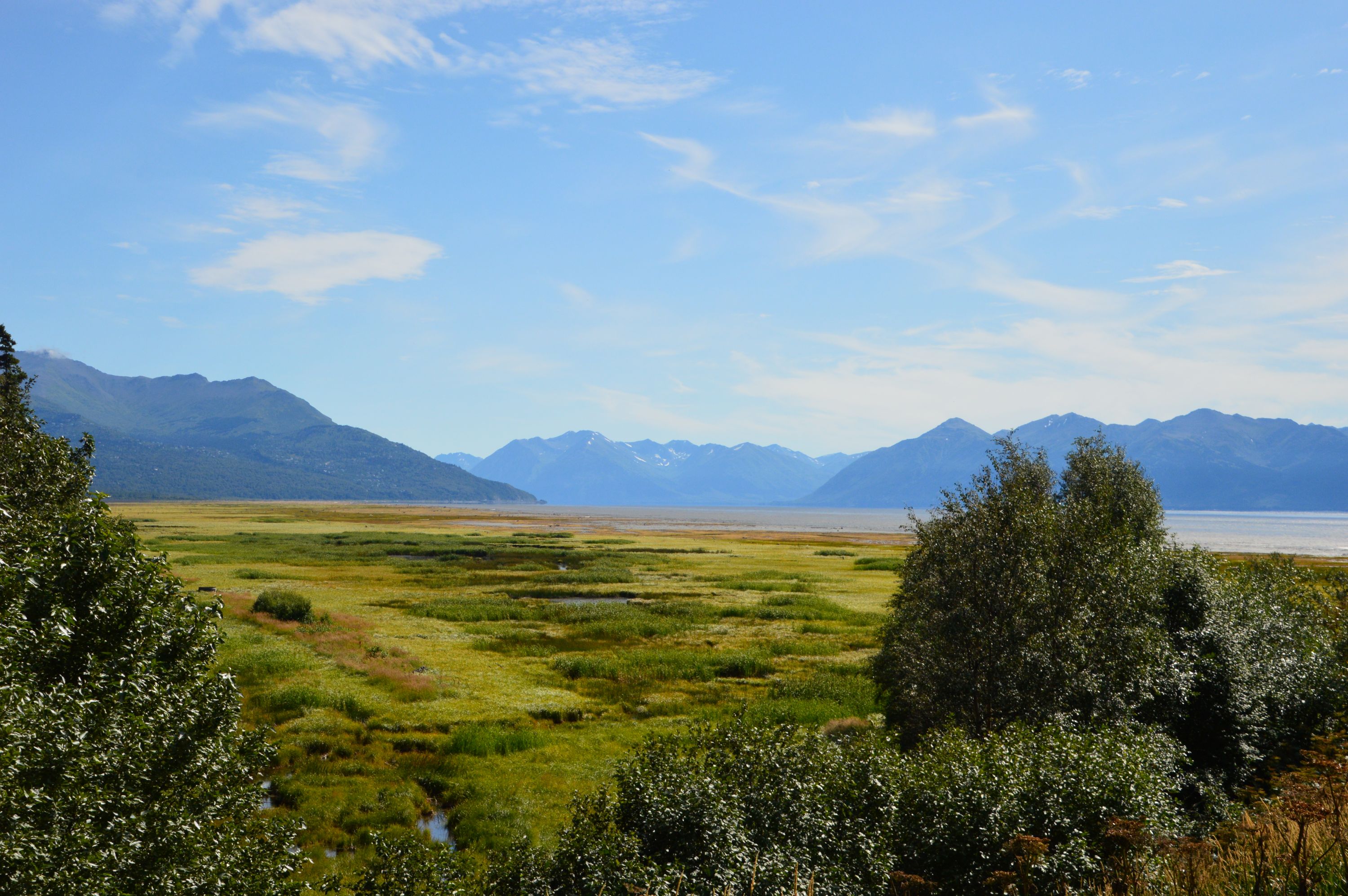 Green valley under blue sky