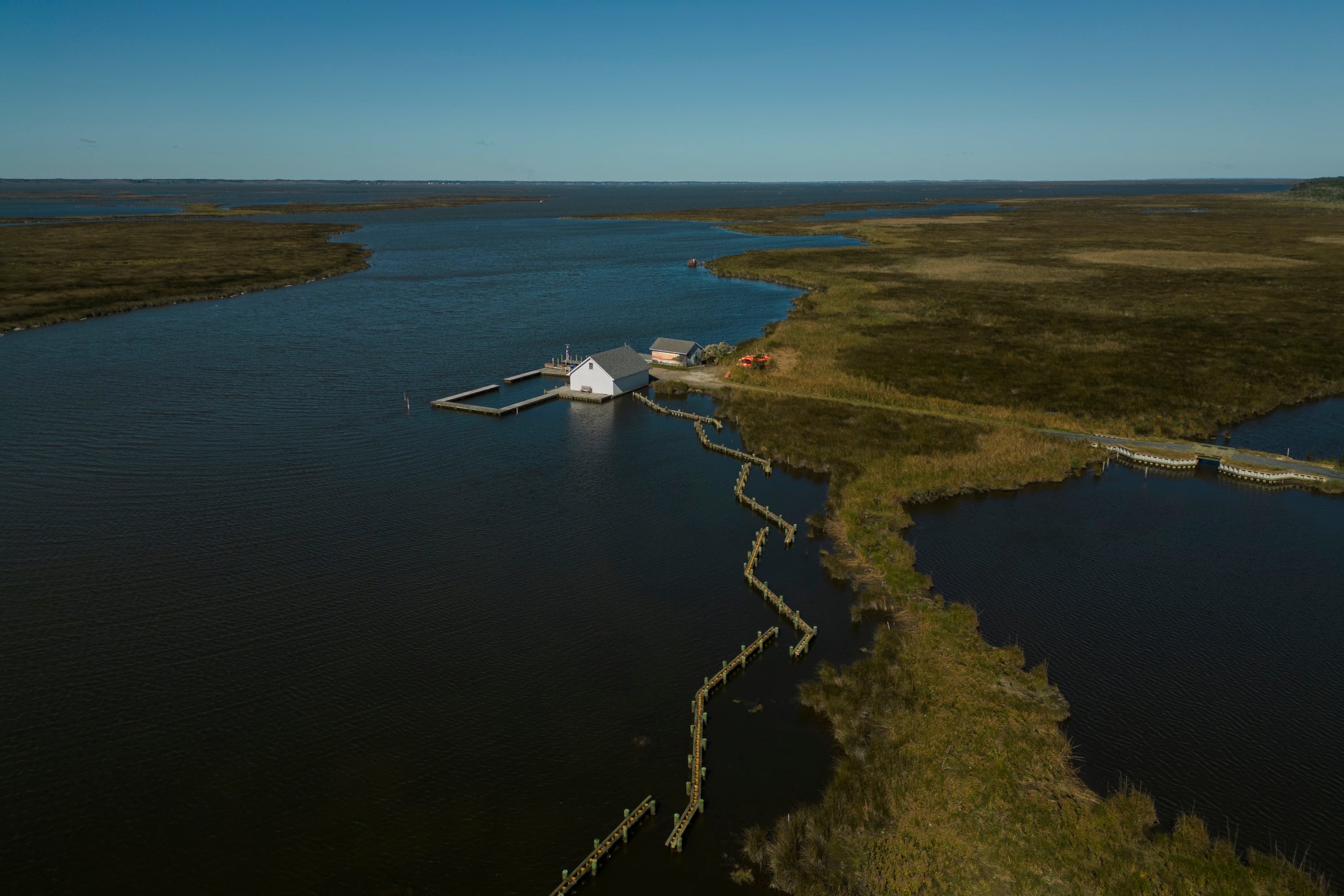 Marsh and boat house at Pine Island. Photo: Sydney Walsh/Audubon