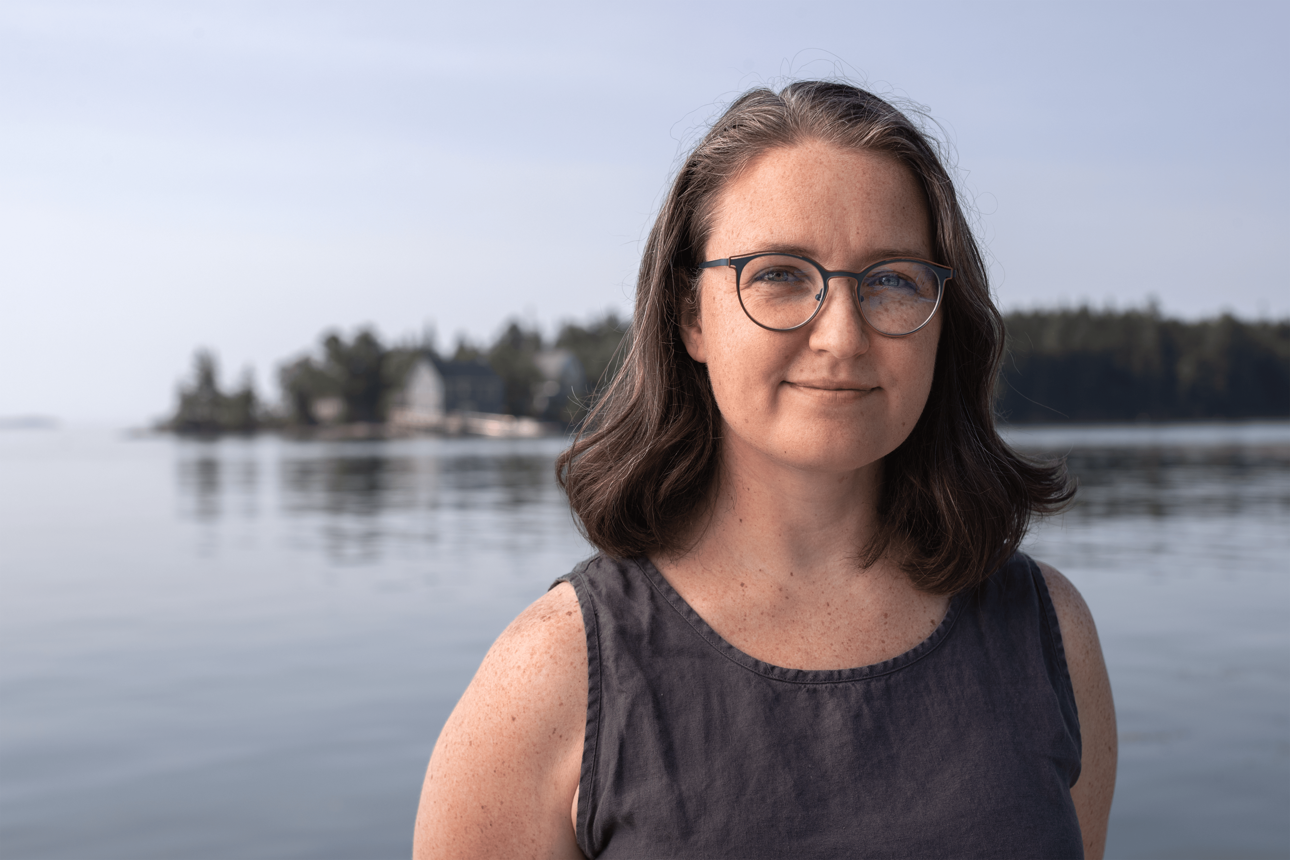 A photo of Kimberly with Hog Island in the background