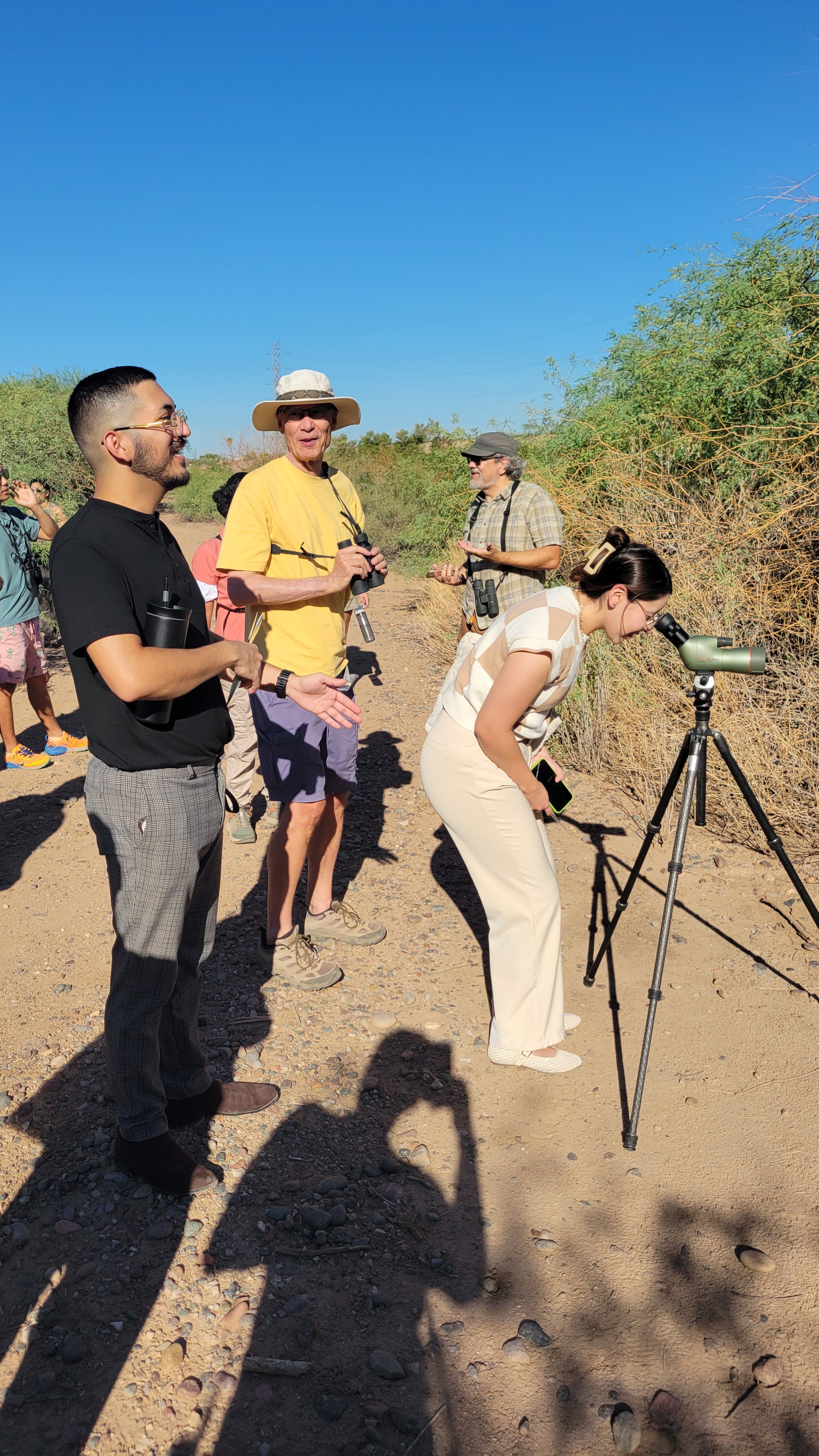 Looking through scope at Rio Salado. Photo: Juliana Gomez/Audubon Southwest