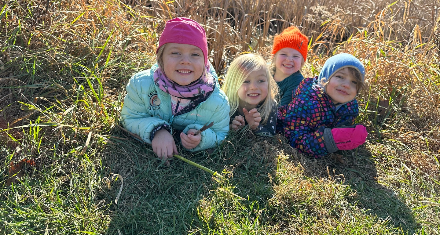 Children exploring pond habitat during a Green Mountain Audubon nature program