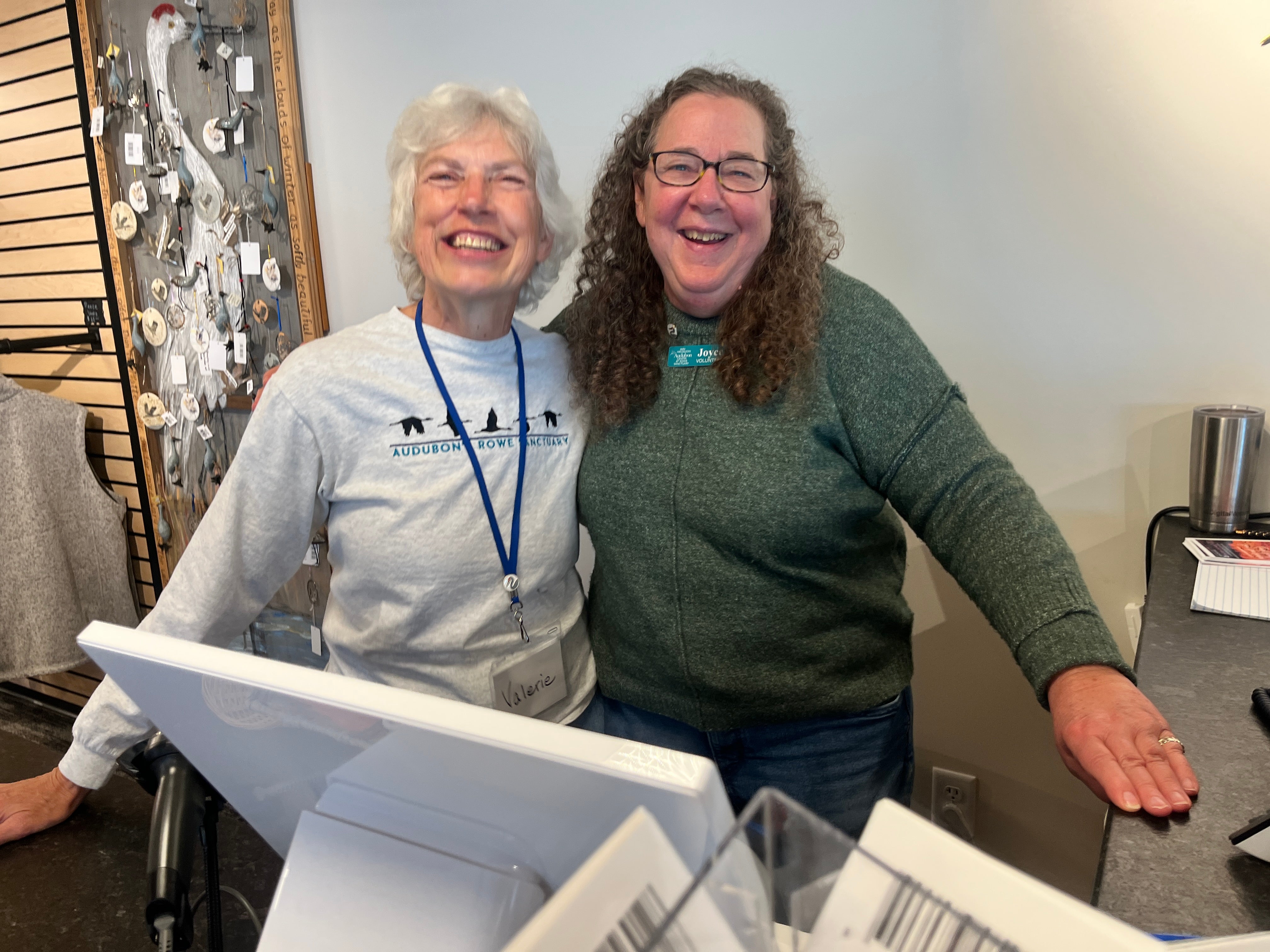 Two women at cashier desk