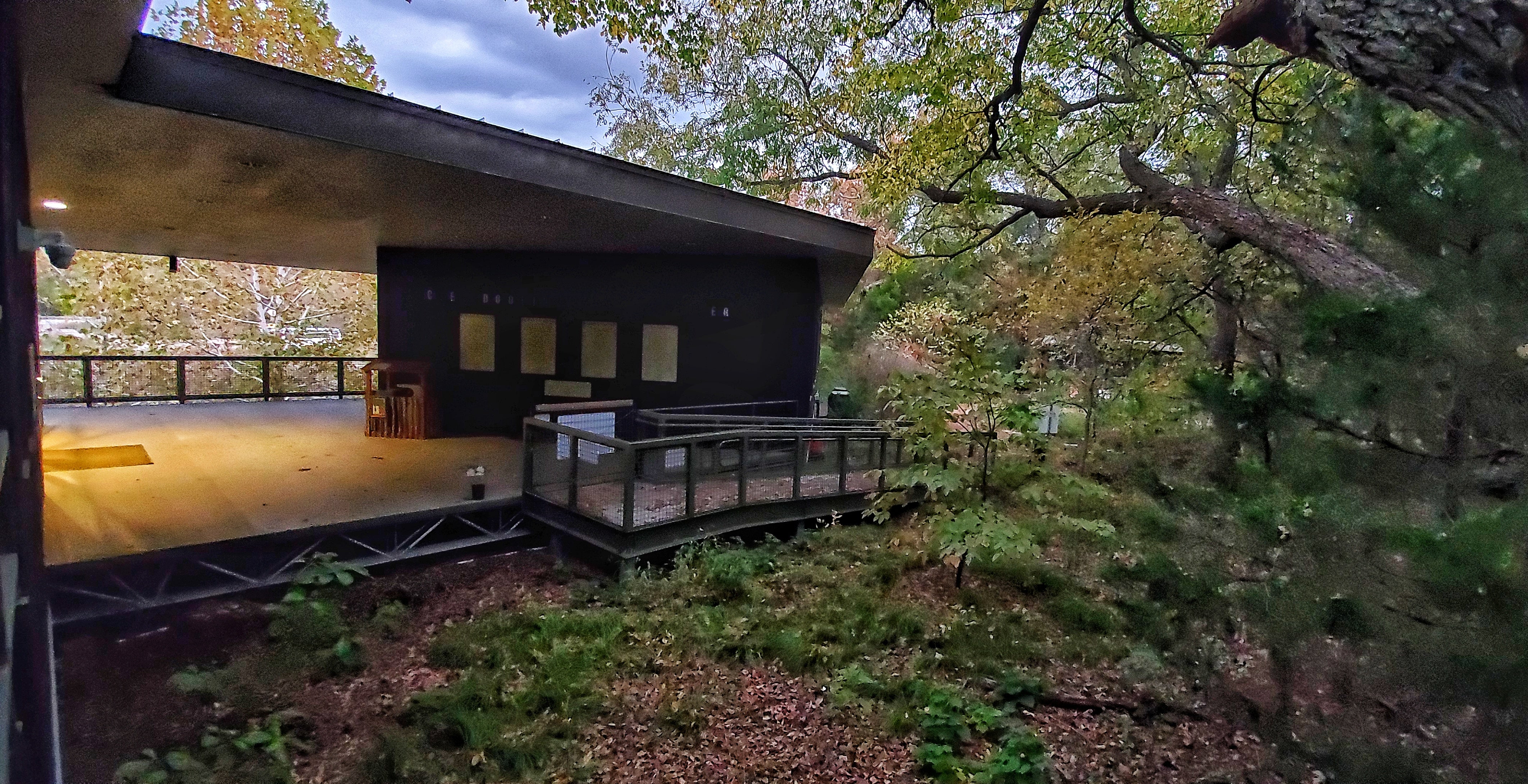 View of back of building breezeway and ramp. 