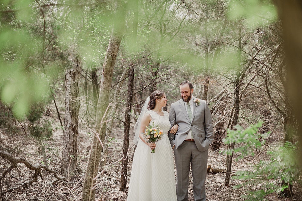 Wedding couple walking in the forest. 