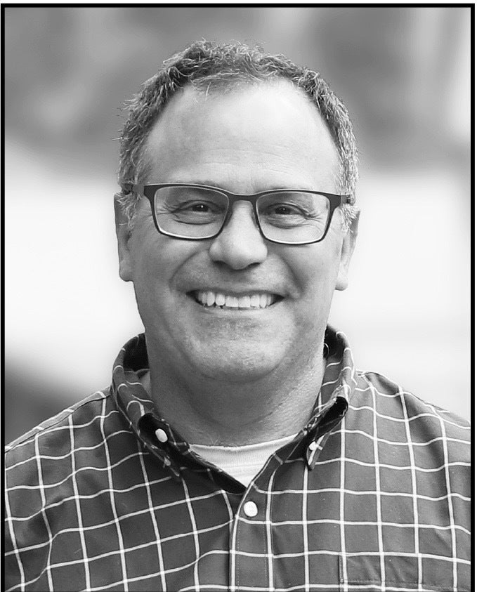 Man in glasses smiling
