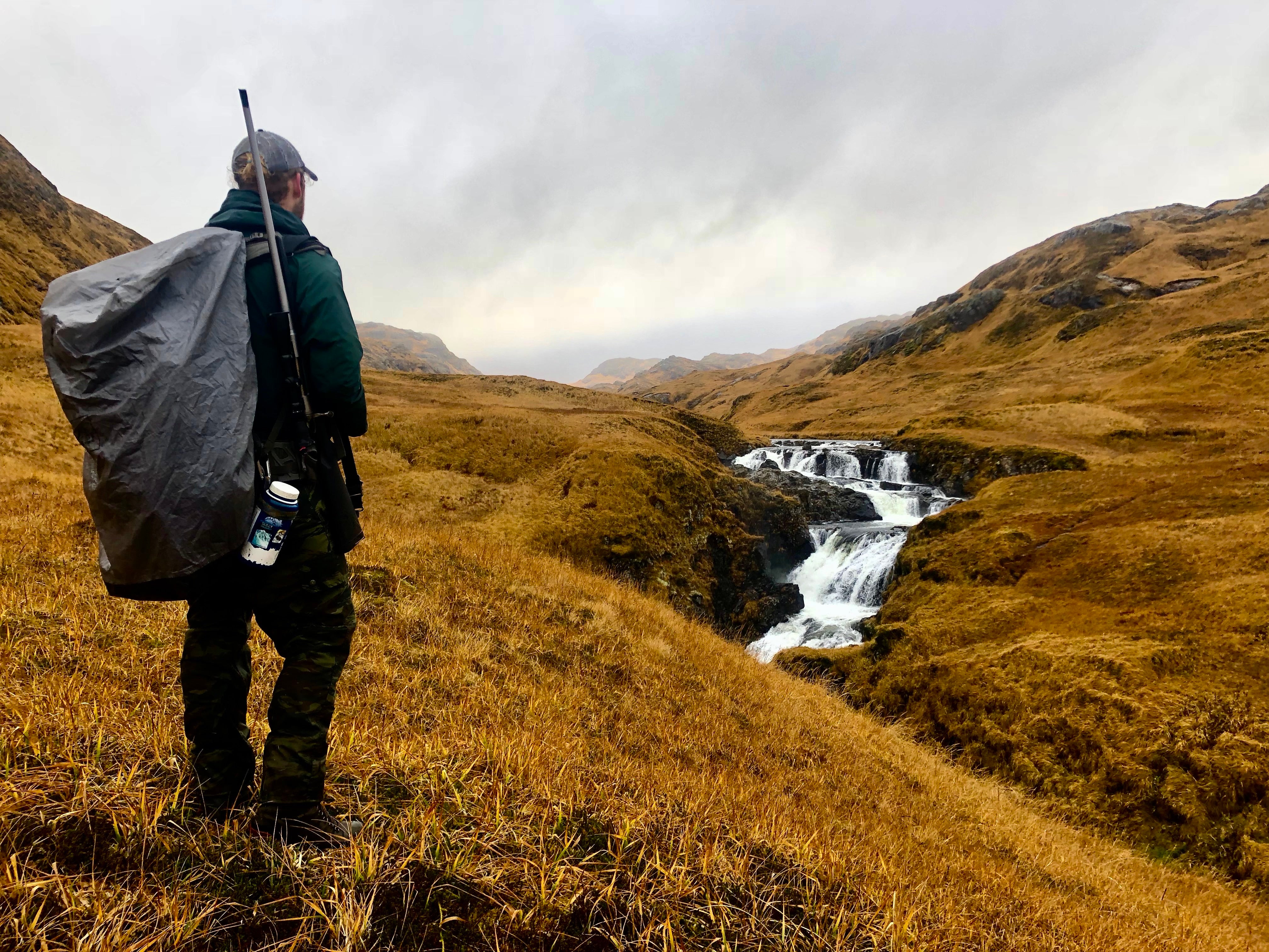 Man with backpack on landscape
