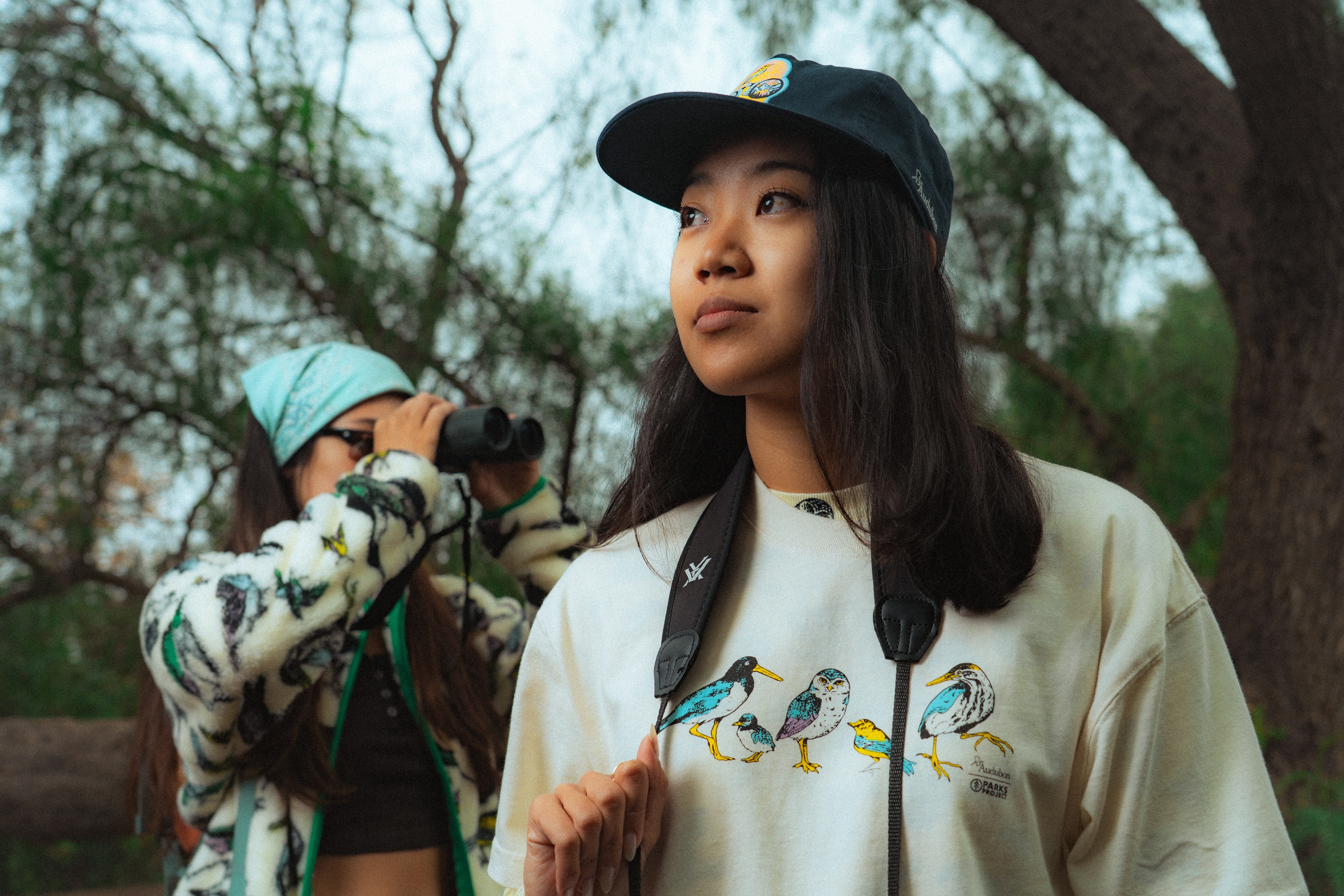 2 women wearing Parks Project x Audubon apparel 