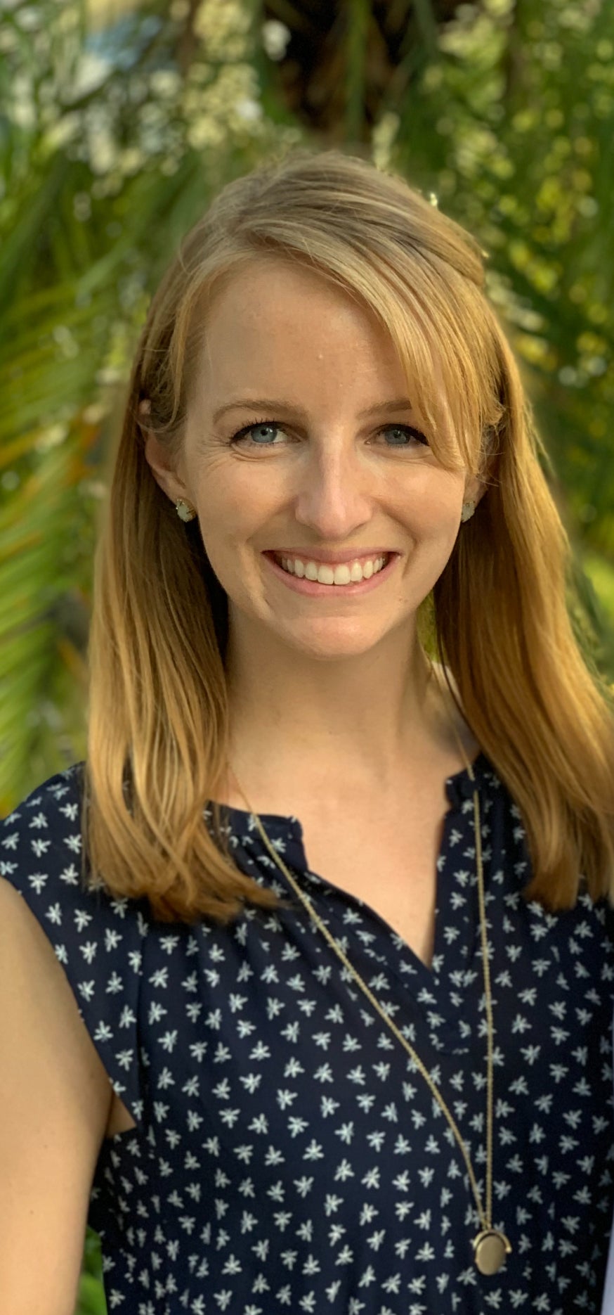a close up photo of a woman wearing a black and white shirt