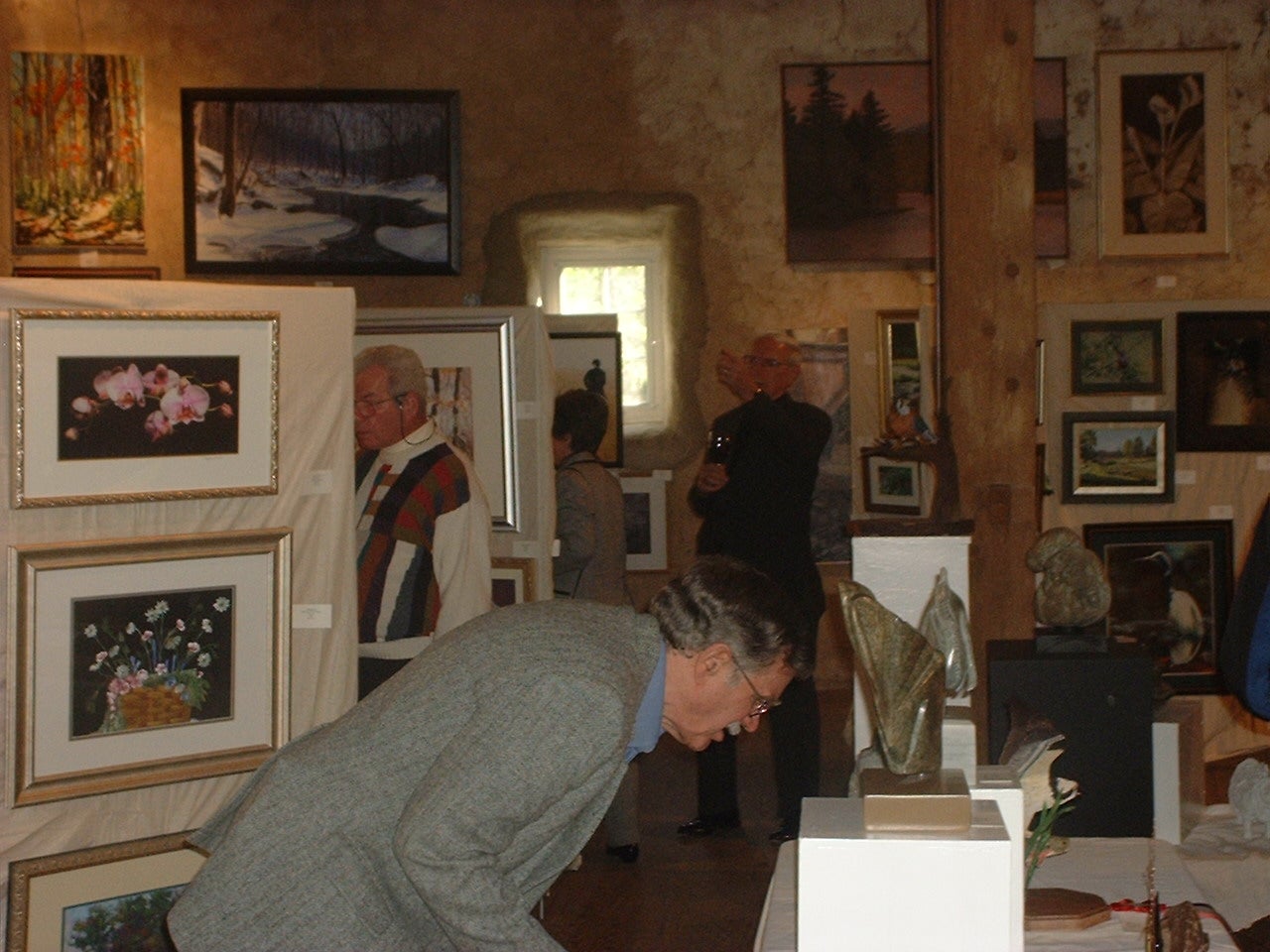 Enjoying the artwork at the JJAC Annual Art Show