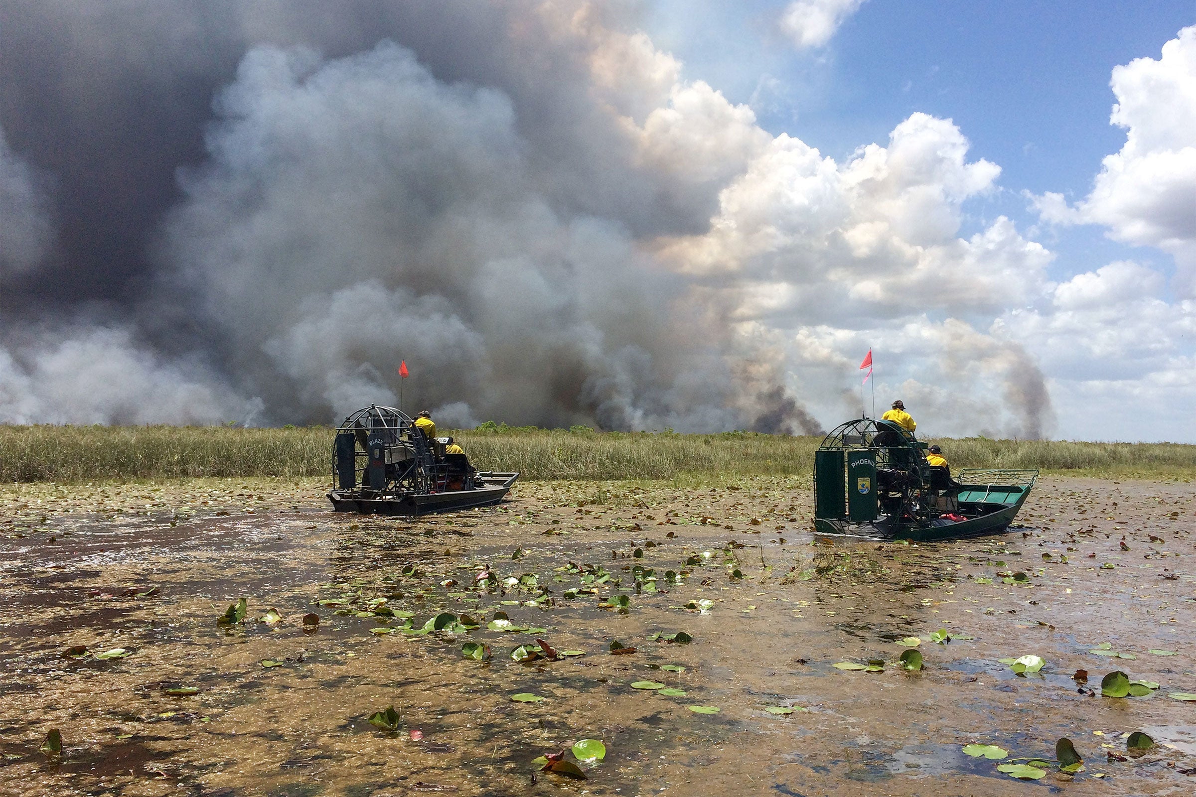 USFWS firemen monitor a prescribed burn in the Everglades area. USFWS/Alamy