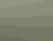 Aerial view of an elevated wooden structure with an antenna in a wetland