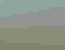 Water with plants surrounding it, with a National Wildlife Refuge sign in front.