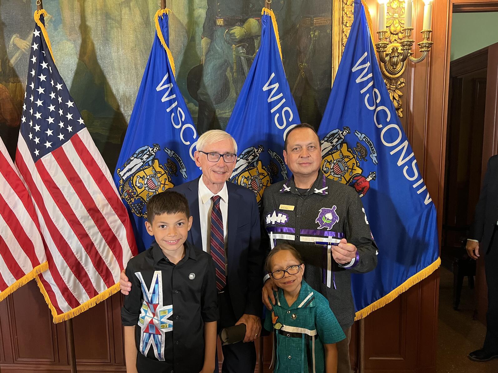 Wisconsin Governor Evers signed the state budget at the State Capitol in Madison, WI. ̽����ѡ Great Lakes Freshwater Policy Director, Brian Vigue, and his children were among the the group that joined the press conference. L to R: Otto Vigue, Wisconsin Go