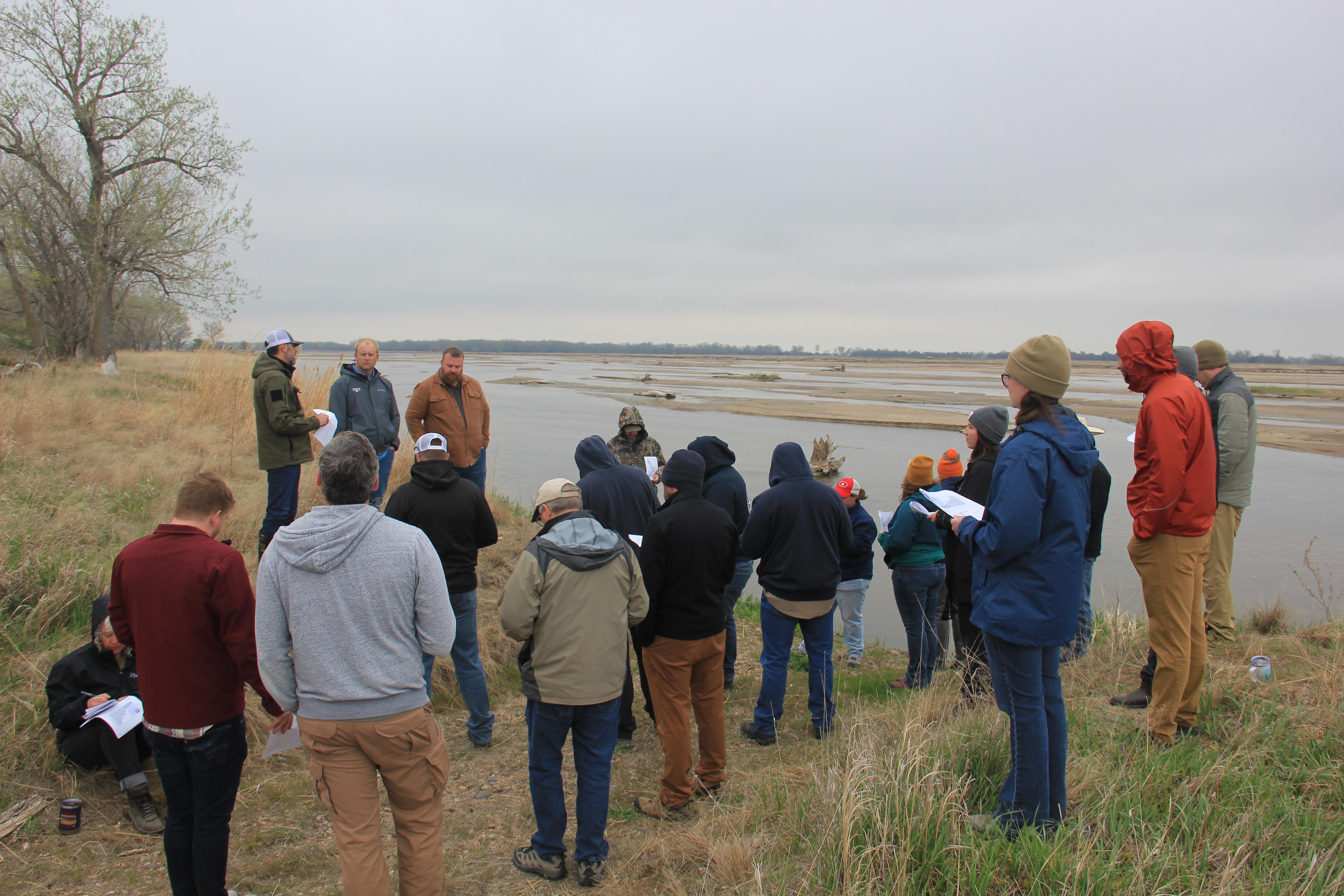 People outside looking at the Platte River