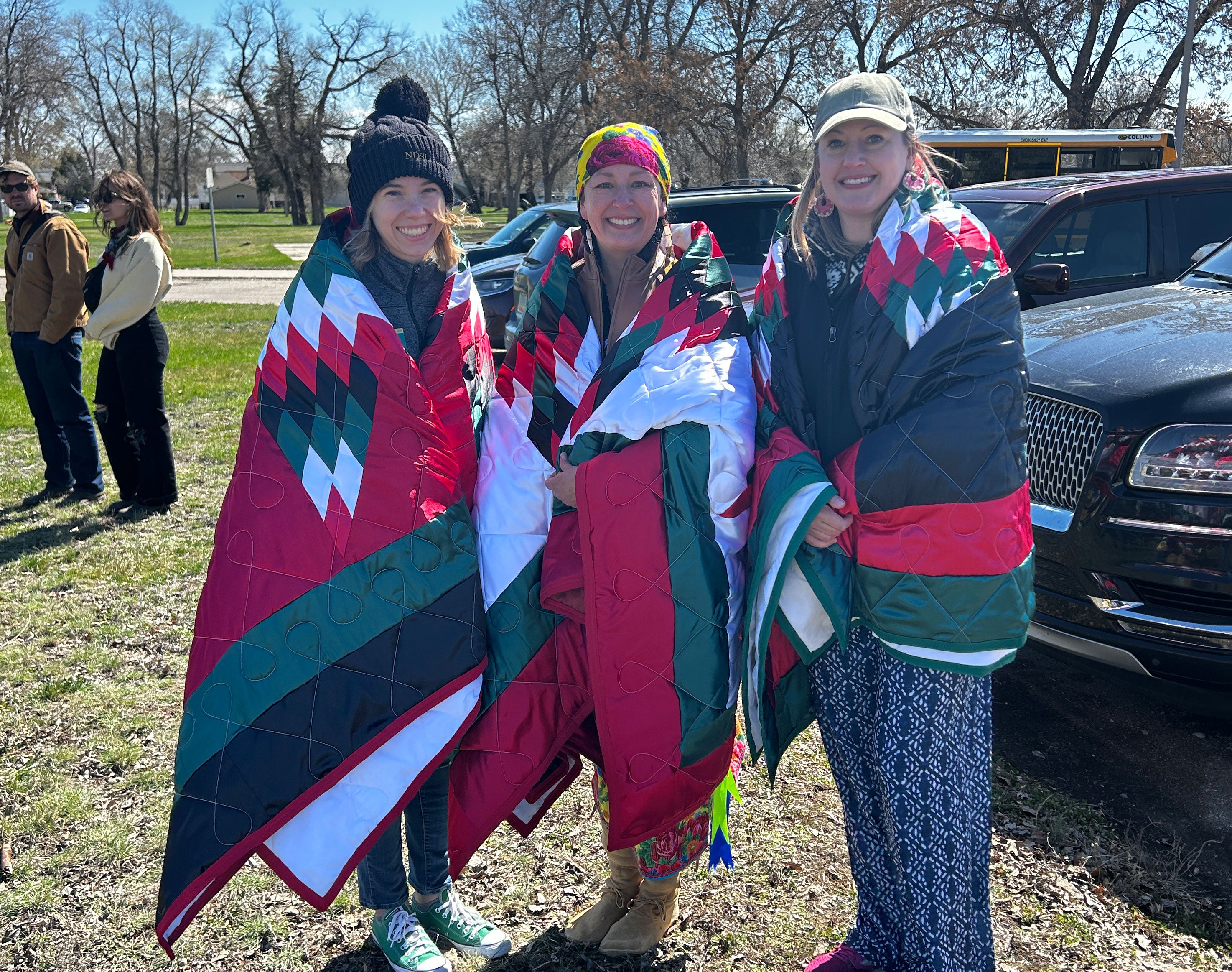 Project partners with red and green star quilts