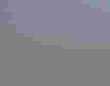 Storm clouds over sagebrush steppe.