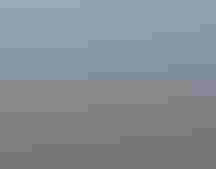 A partial rainbow over sagebrush steppe landscape.