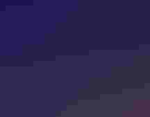 A man and a woman stand at a podium in front of an audience.