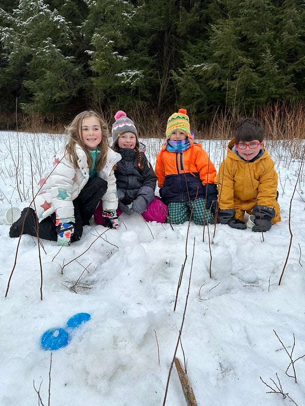 Students with snow castle