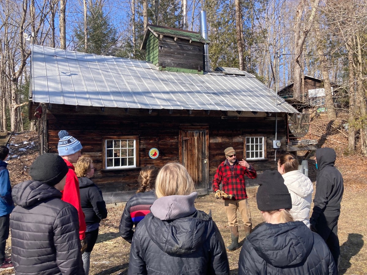 Conservation Biologist Steve Hagenbuch addressing a group of JCTs outside the sugarhouse.