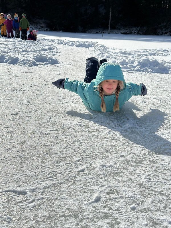 student sliding on the ice