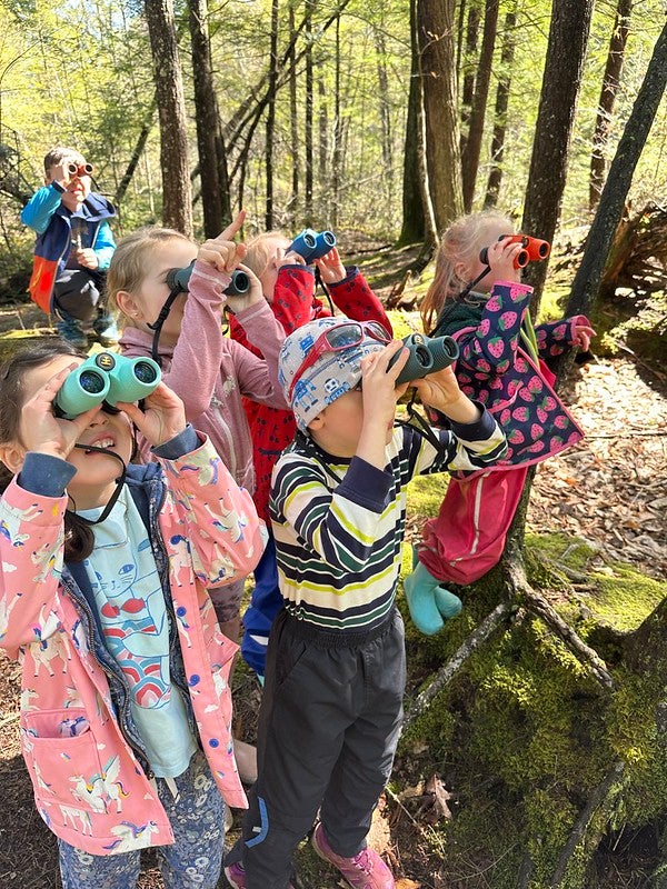 students using binoculars