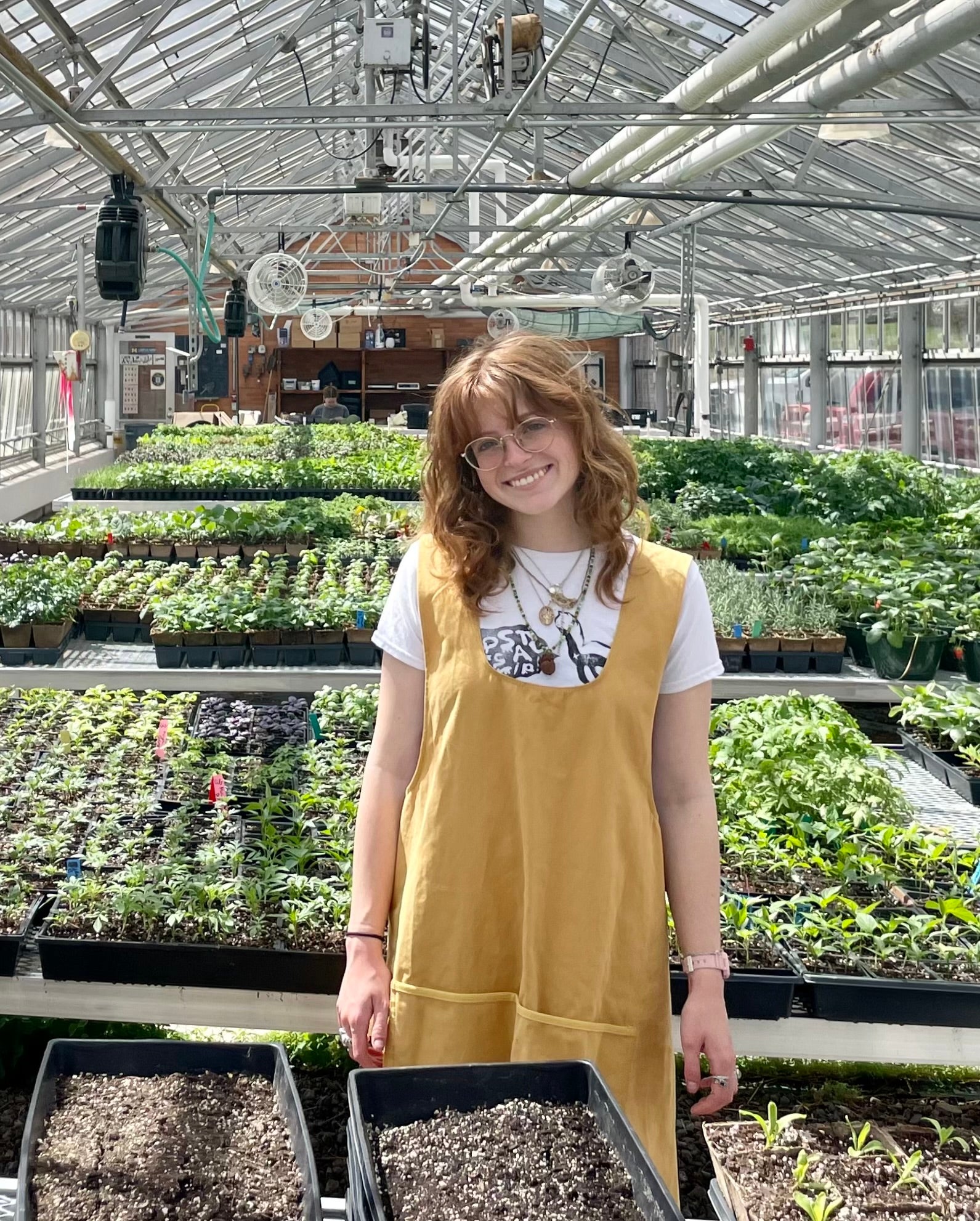 Emma standing in a garden