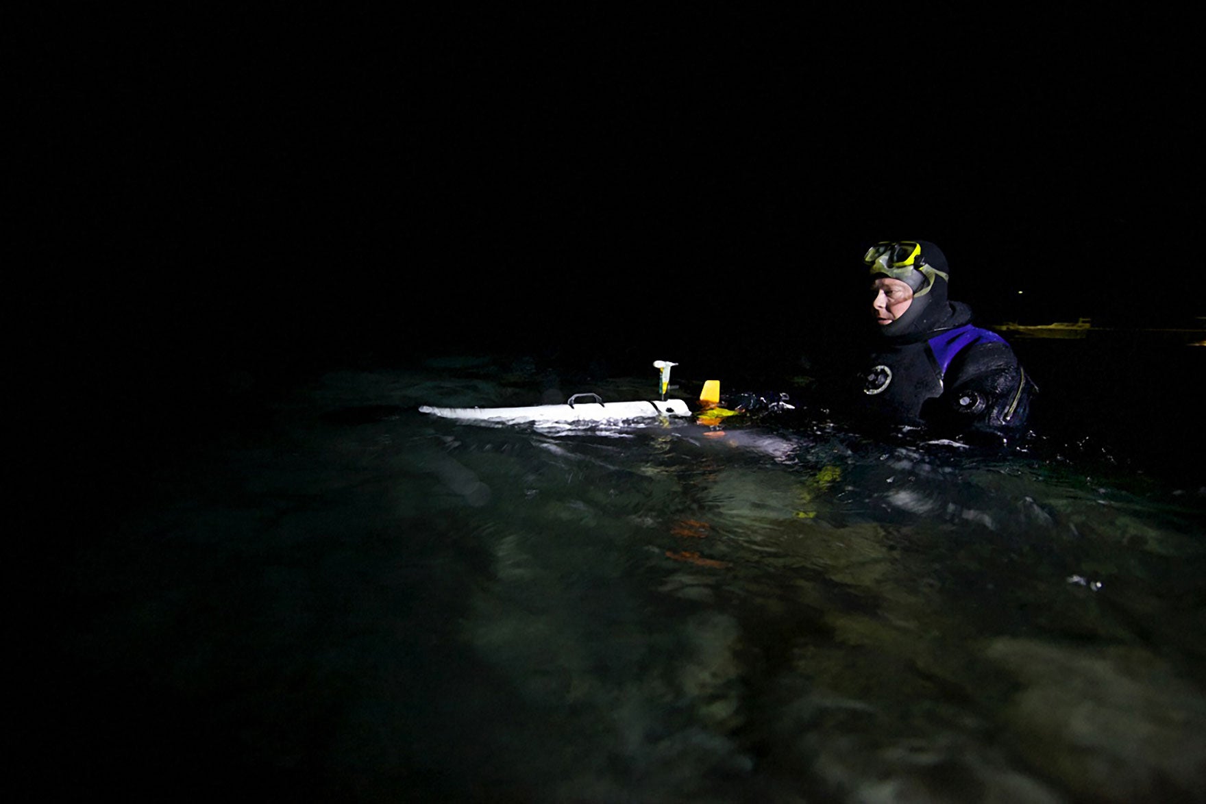 Project leader Jorgen Berge launches an underwater robot that measures temperature, salinity, and density. Geir Johnsen/NTNU