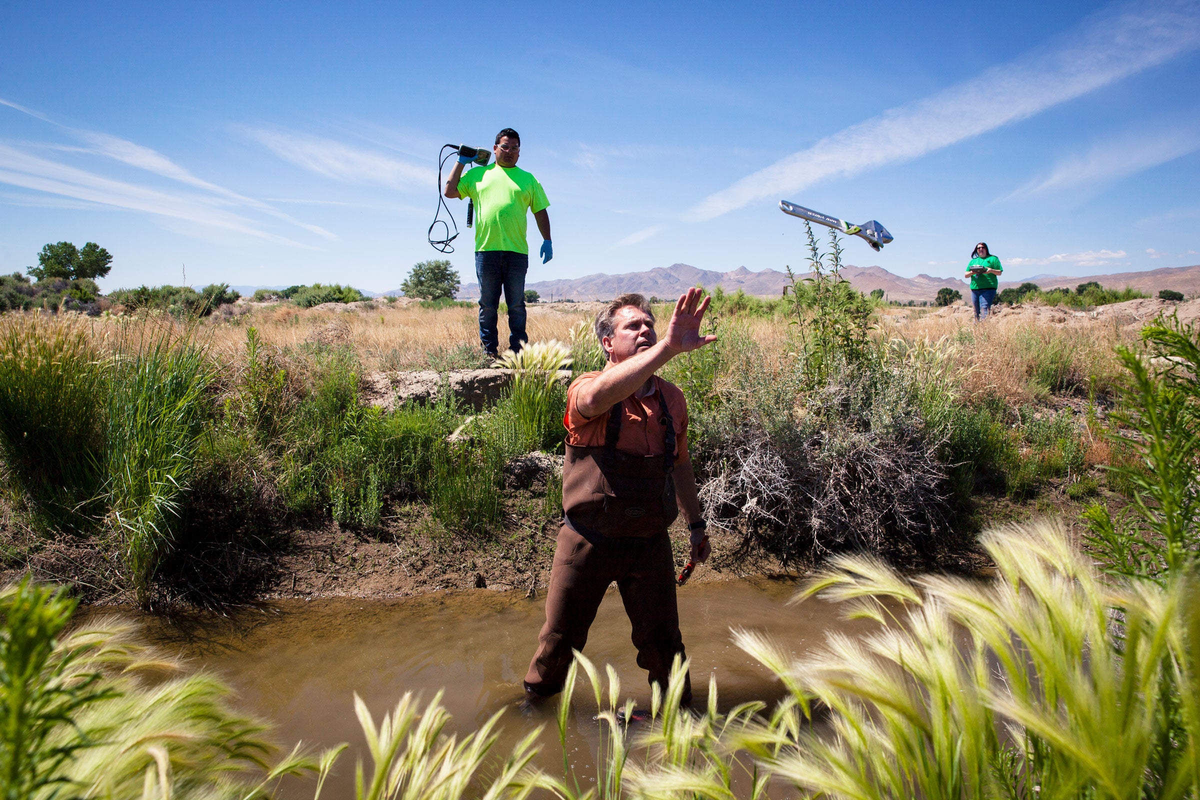 Dietrick McGinnis, environmental consultant for the Yerington Paiute Tribe, tests the water from the Tribal Wetlands. High levels of uranium, arsenic, and other toxins have been found in groundwater on the reservation. Maggie Starbard
