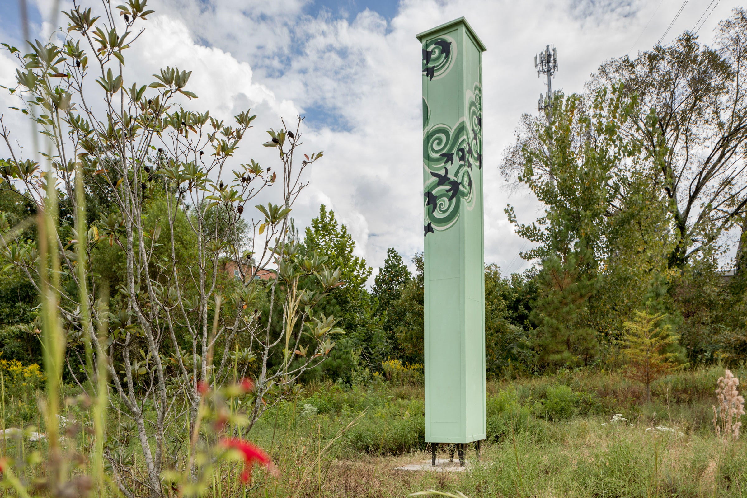 Scarlet sage flowers hem the new Atlanta Audubon swift tower in Piedmont Park. Jessie Parks