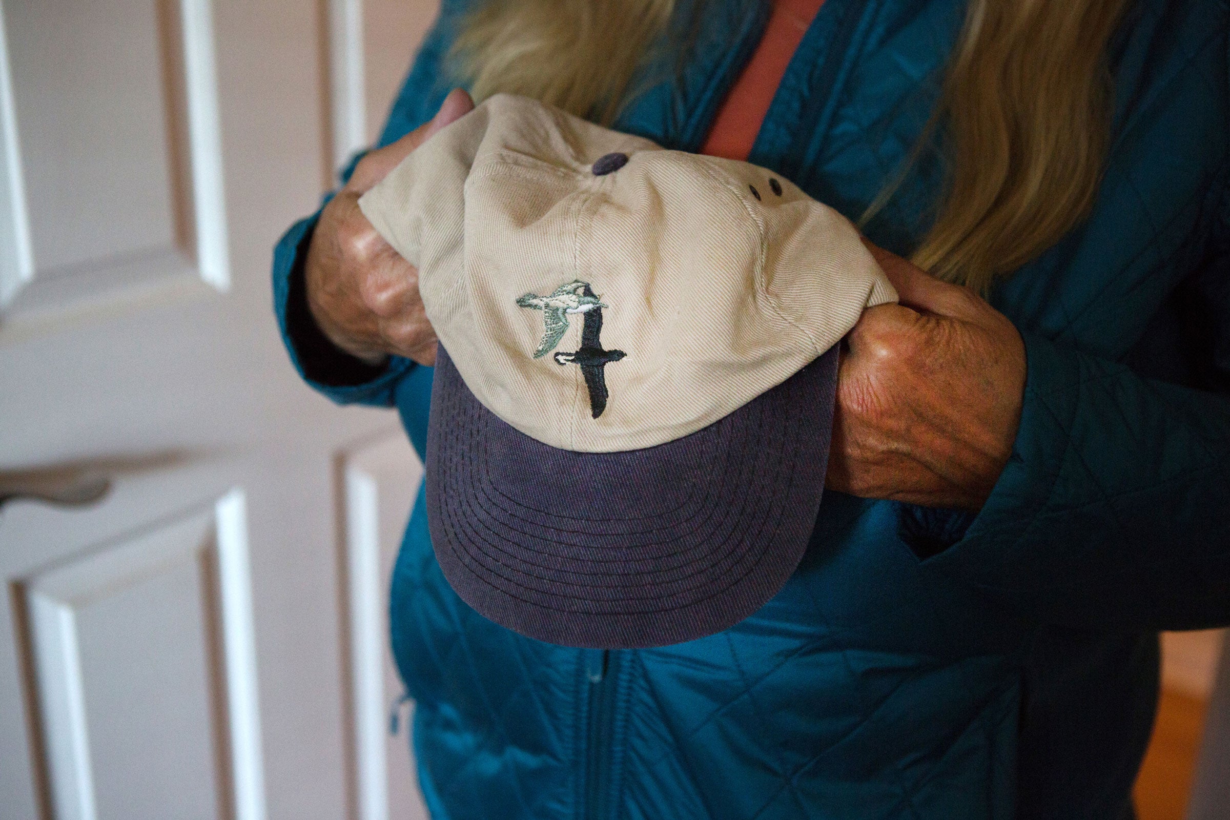 Inside her home in Hollister, California, Shearwater holds one of her company's original hats. Lauren Owens Lambert