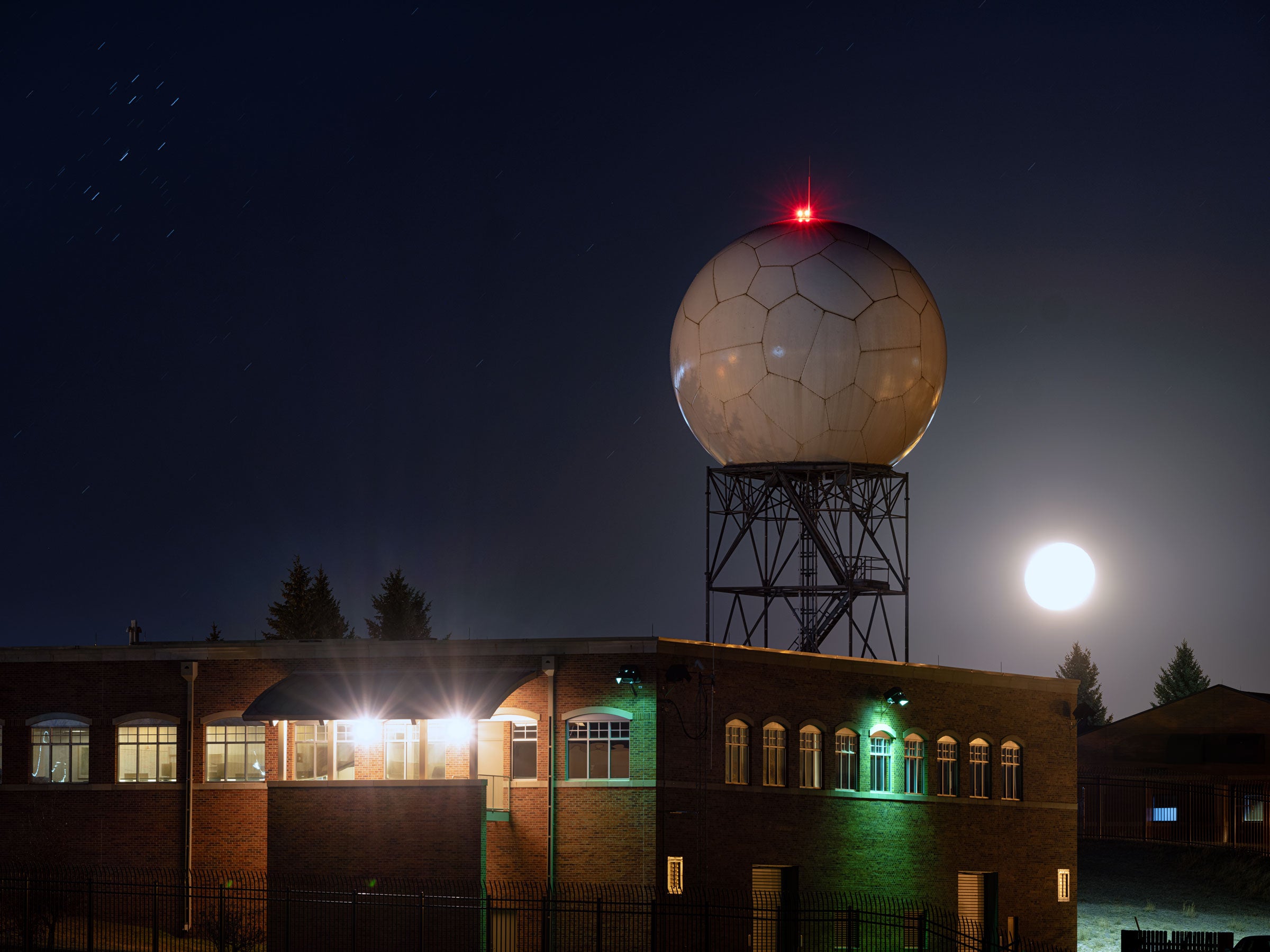 Waves scattered from this NOAA Doppler radar tower in Wyoming help detect nighttime migratory birds—data that Horton uses to create BirdCast forecasts. Keith Ladzinski
