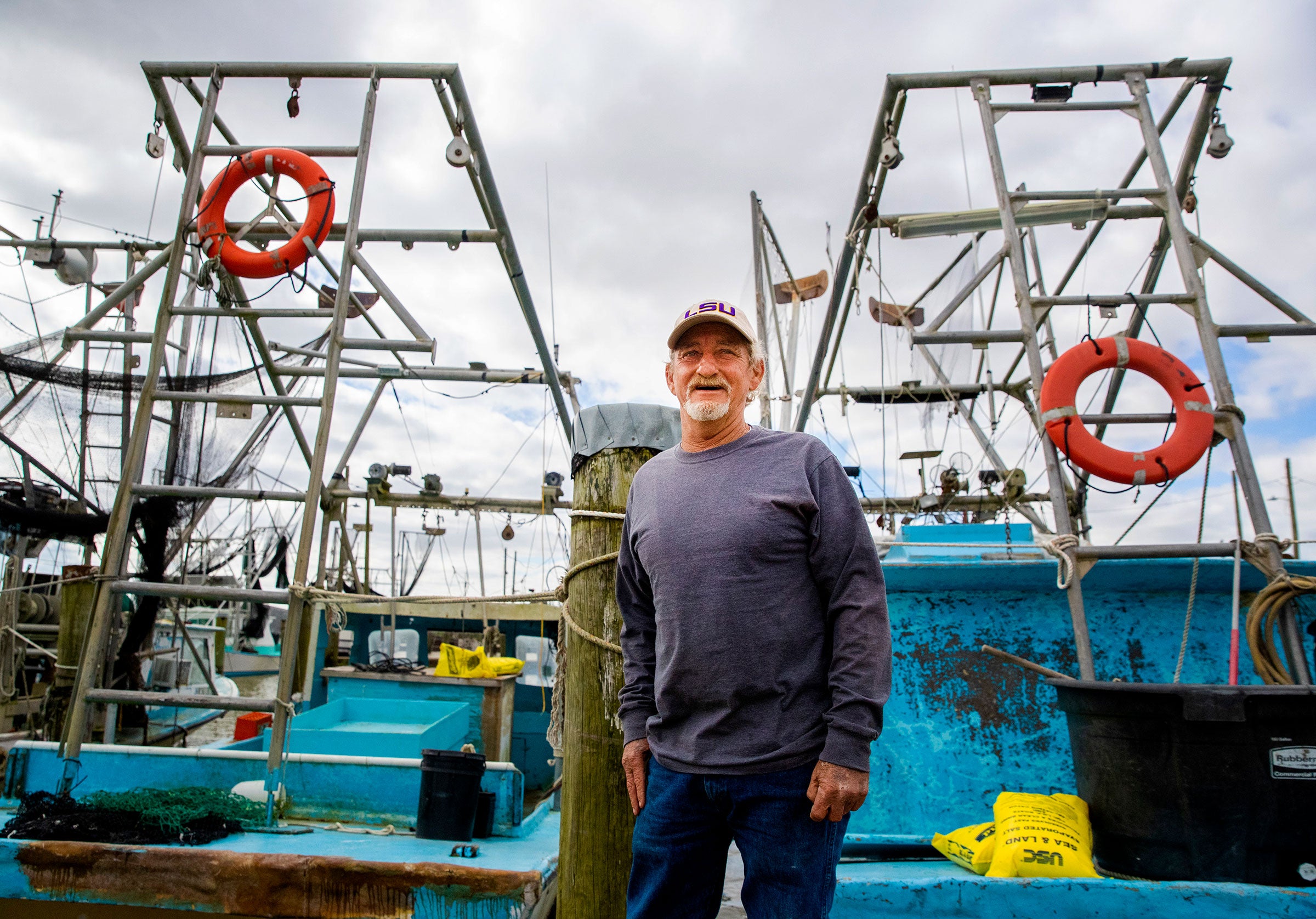 Third-generation shrimper Acy Cooper worries the project will put him out of business.